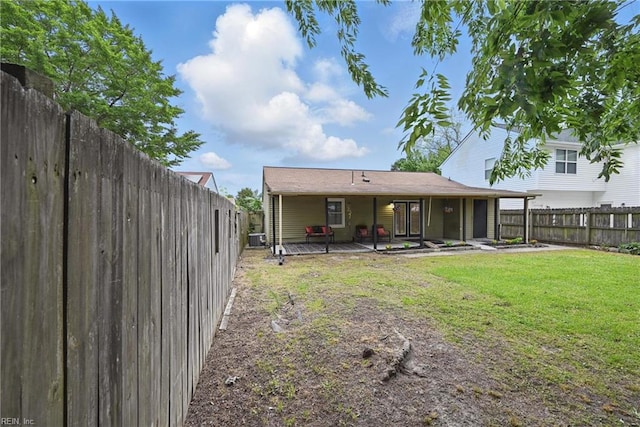 2405 Minnesota Ave, Norfolk, VA 23513 - rear view of house with a patio and central AC