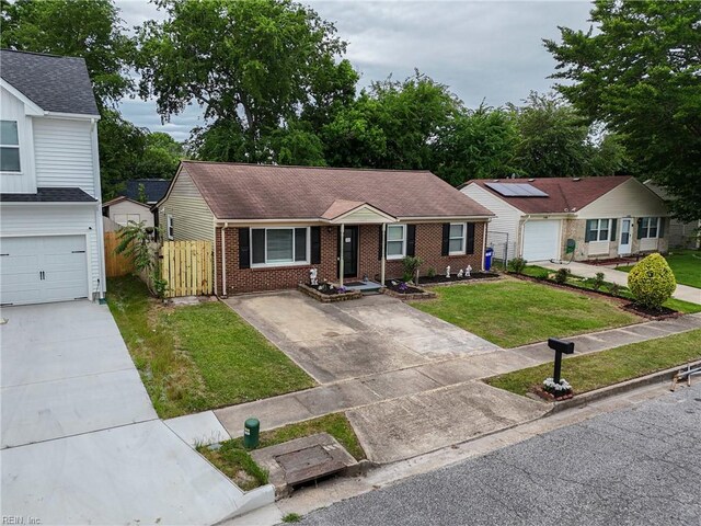 2405 Minnesota Ave, Norfolk, VA 23513 - ranch-style home with concrete driveway, brick siding, and roof with shingles