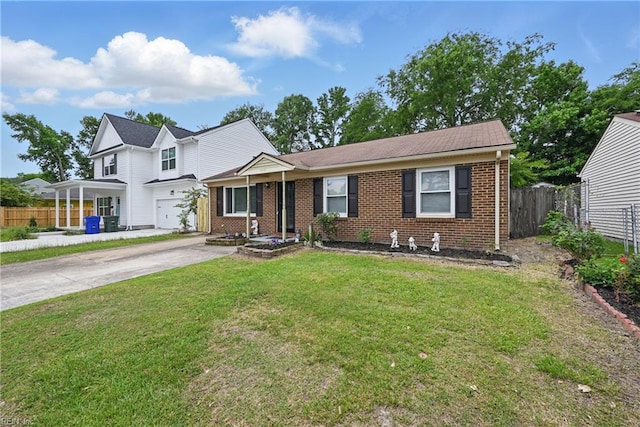2405 Minnesota Ave, Norfolk, VA 23513 - view of front of home featuring brick siding, concrete driveway, and an attached garage