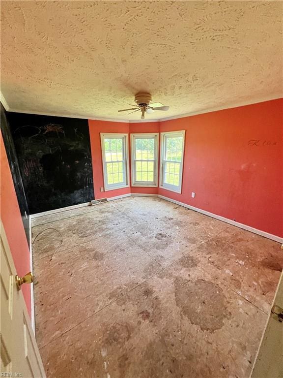 15310 Loco School Rd, Stony Creek, VA 23882 - unfurnished room with a textured ceiling, a ceiling fan, and baseboards