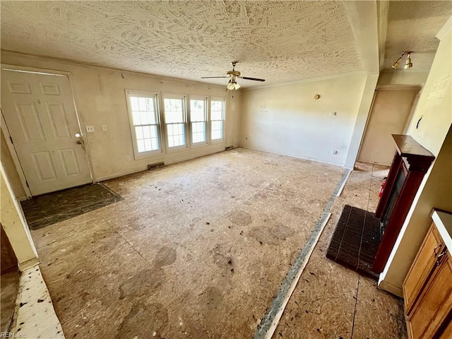 15310 Loco School Rd, Stony Creek, VA 23882 - unfurnished living room featuring a ceiling fan and a textured ceiling