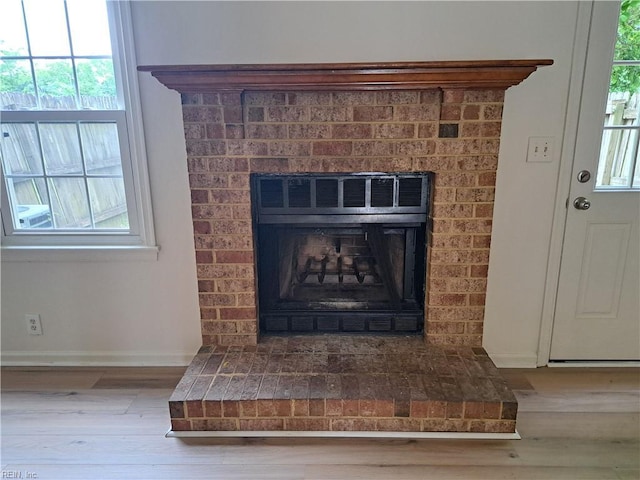 5636 Campus Dr, Virginia Beach, VA 23462 - detailed view of a brick fireplace, wood finished floors, and baseboards