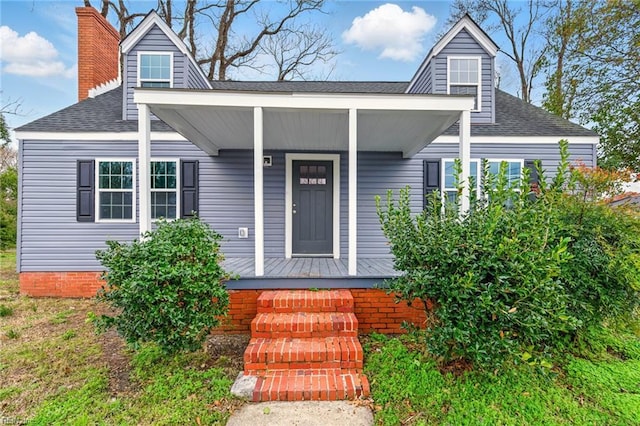 102 Frissell St, Hampton, VA 23663 - view of front of home with covered porch, a chimney, and a shingled roof