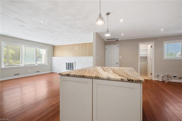 725 Lord Nelson Dr, Virginia Beach, VA 23464 - kitchen with dark wood-style flooring, a center island, baseboards, open floor plan, and hanging light fixtures