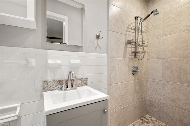 725 Lord Nelson Dr, Virginia Beach, VA 23464 - bathroom with a tile shower, vanity, and tile walls