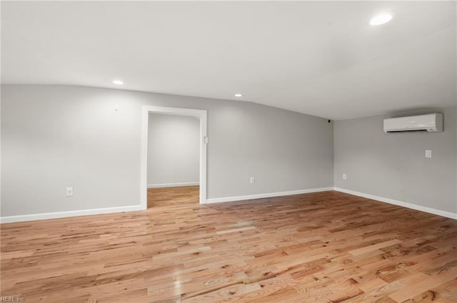 725 Lord Nelson Dr, Virginia Beach, VA 23464 - spare room with an AC wall unit, recessed lighting, light wood finished floors, and baseboards