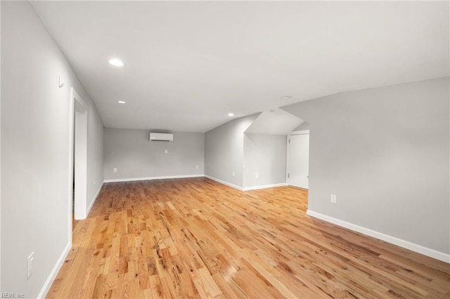 725 Lord Nelson Dr, Virginia Beach, VA 23464 - additional living space with an AC wall unit, light wood-type flooring, recessed lighting, and baseboards