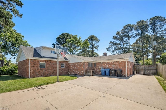 725 Lord Nelson Dr, Virginia Beach, VA 23464 - view of side of home with brick siding and a gate