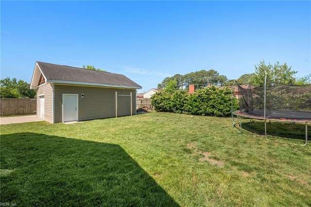 725 Lord Nelson Dr, Virginia Beach, VA 23464 - view of yard featuring a trampoline, an outbuilding, and a garage