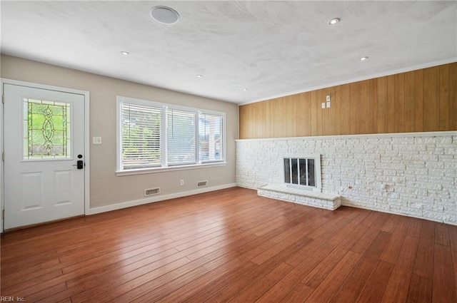 725 Lord Nelson Dr, Virginia Beach, VA 23464 - unfurnished living room with wood finished floors, baseboards, a brick fireplace, and recessed lighting