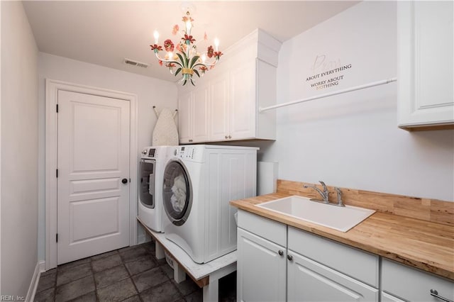 440 Goodspeed Rd, Virginia Beach, VA 23451 - laundry area with separate washer and dryer, cabinet space, baseboards, and a chandelier