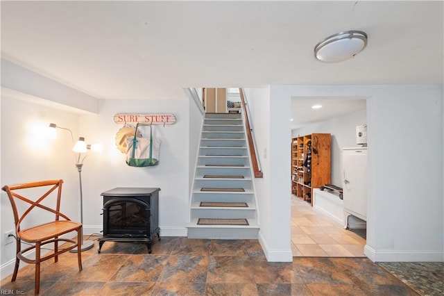 440 Goodspeed Rd, Virginia Beach, VA 23451 - stairs with a wood stove, baseboards, and stone finish flooring