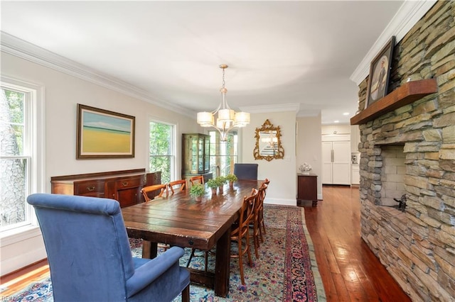 440 Goodspeed Rd, Virginia Beach, VA 23451 - dining room featuring a chandelier, hardwood / wood-style floors, healthy amount of natural light, crown molding, and baseboards