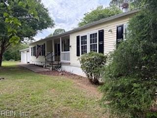975 Burchs Mill Rd, Urbanna, VA 23175 - rear view of house featuring a yard