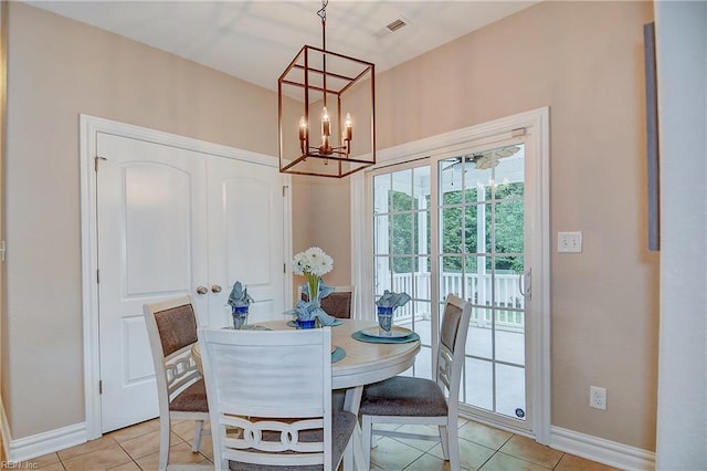 501 Beagle Gap Ct, Chesapeake, VA 23320 - dining space featuring light tile patterned floors, baseboards, and a chandelier
