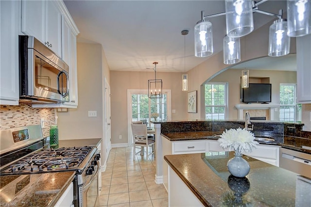 501 Beagle Gap Ct, Chesapeake, VA 23320 - kitchen featuring appliances with stainless steel finishes, white cabinets, decorative backsplash, and a sink