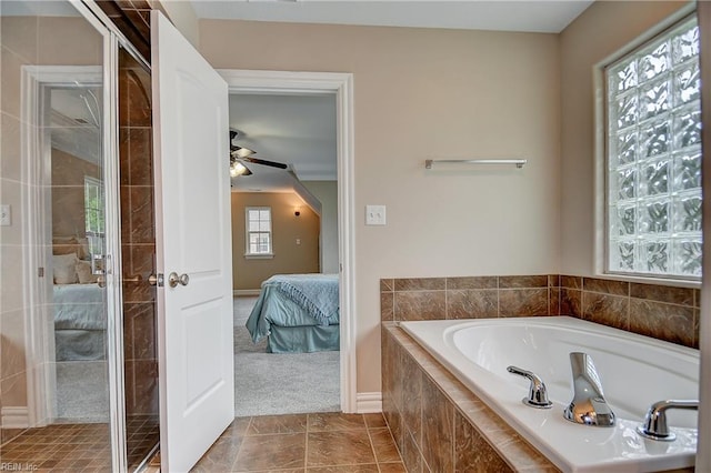 501 Beagle Gap Ct, Chesapeake, VA 23320 - ensuite bathroom with a bath, a ceiling fan, a shower stall, and baseboards