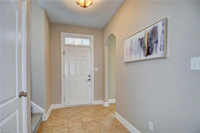 501 Beagle Gap Ct, Chesapeake, VA 23320 - foyer entrance featuring arched walkways, light tile patterned floors, and baseboards