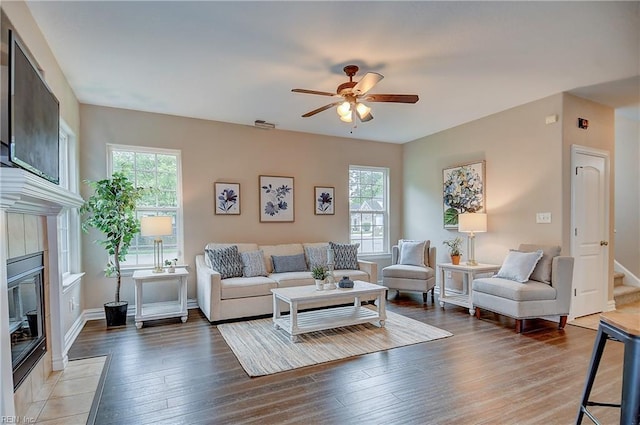 501 Beagle Gap Ct, Chesapeake, VA 23320 - living room featuring ceiling fan, healthy amount of natural light, a tiled fireplace, and light wood-type flooring
