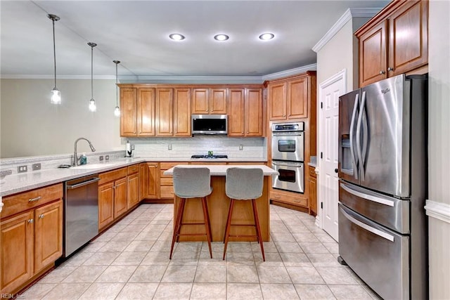 604 Schooner Blvd, Williamsburg, VA 23185 - kitchen featuring stainless steel appliances, a sink, tasteful backsplash, ornamental molding, and a breakfast bar area