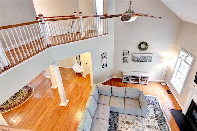 604 Schooner Blvd, Williamsburg, VA 23185 - living room featuring high vaulted ceiling, a ceiling fan, wood finished floors, baseboards, and stairs