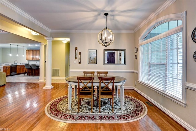 604 Schooner Blvd, Williamsburg, VA 23185 - dining space with decorative columns, hardwood / wood-style flooring, ornamental molding, and baseboards