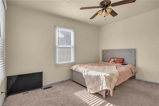2020 County St, Portsmouth, VA 23704 - carpeted bedroom with baseboards and a ceiling fan