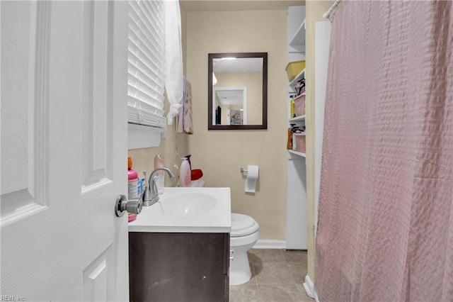 2020 County St, Portsmouth, VA 23704 - full bathroom with tile patterned floors, vanity, toilet, baseboards, and curtained shower