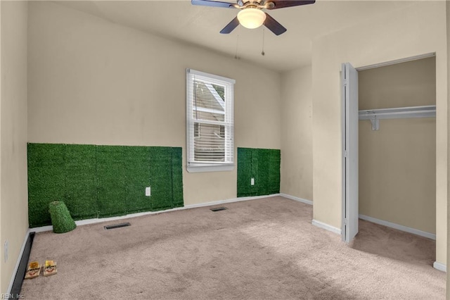 2020 County St, Portsmouth, VA 23704 - unfurnished bedroom with carpet, baseboards, a ceiling fan, and a closet