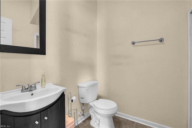 2020 County St, Portsmouth, VA 23704 - bathroom with vanity, toilet, baseboards, and tile patterned floors