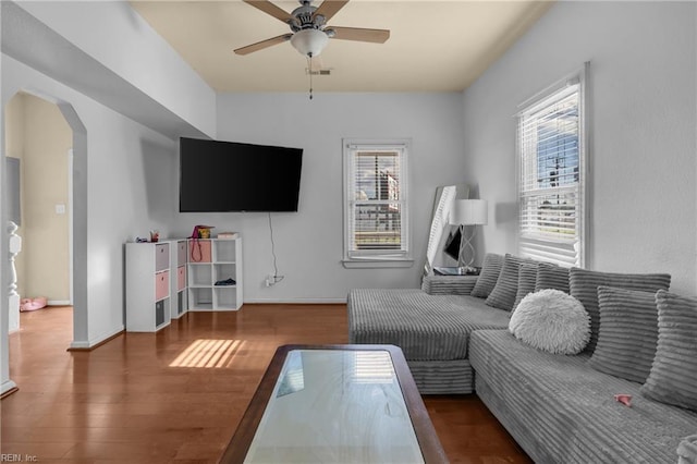 2020 County St, Portsmouth, VA 23704 - living room with arched walkways, a ceiling fan, wood finished floors, and baseboards