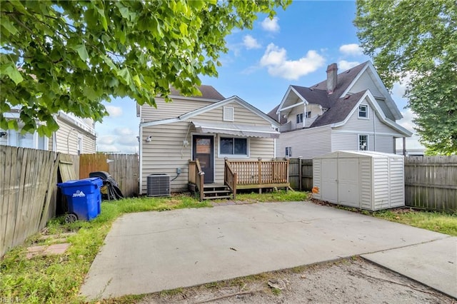 2020 County St, Portsmouth, VA 23704 - rear view of house featuring a deck, a fenced backyard, a patio area, and central air condition unit
