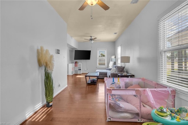 2020 County St, Portsmouth, VA 23704 - living area with a ceiling fan and wood finished floors