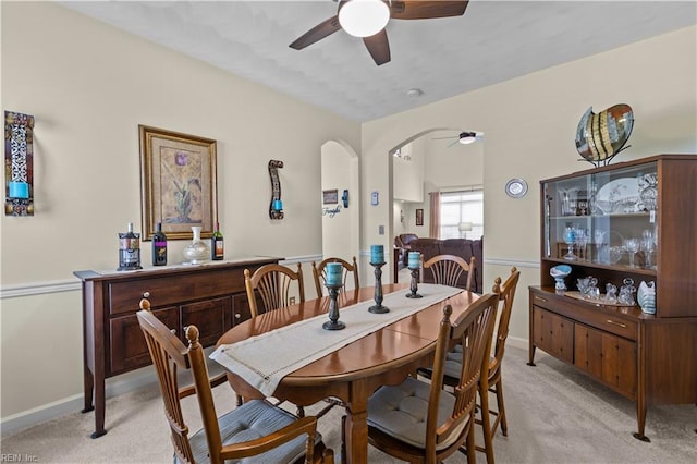 2612 Einstein Dr, Virginia Beach, VA 23456 - dining space featuring a ceiling fan, light colored carpet, baseboards, and arched walkways