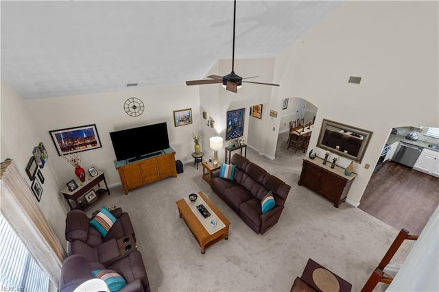 2612 Einstein Dr, Virginia Beach, VA 23456 - living area featuring arched walkways, a ceiling fan, carpet, baseboards, and high vaulted ceiling