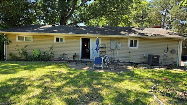 769 Olivieri Ln, Virginia Beach, VA 23455 - back of property featuring central AC, a lawn, and a chimney