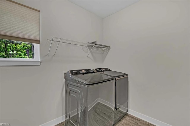 101 Daybeacon St, Yorktown, VA 23692 - washroom with washing machine and clothes dryer, baseboards, and wood finished floors