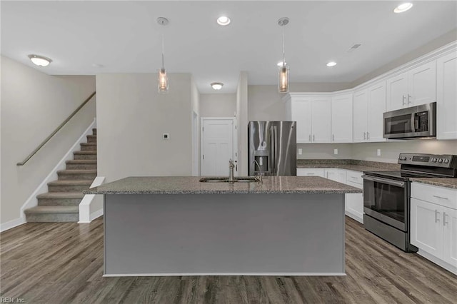 101 Daybeacon St, Yorktown, VA 23692 - kitchen featuring stainless steel appliances, a sink, dark wood-type flooring, dark stone countertops, and recessed lighting