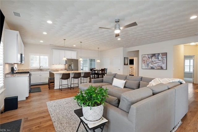 145 Beacon Run, Suffolk, VA 23435 - living area featuring ceiling fan, recessed lighting, and light wood finished floors