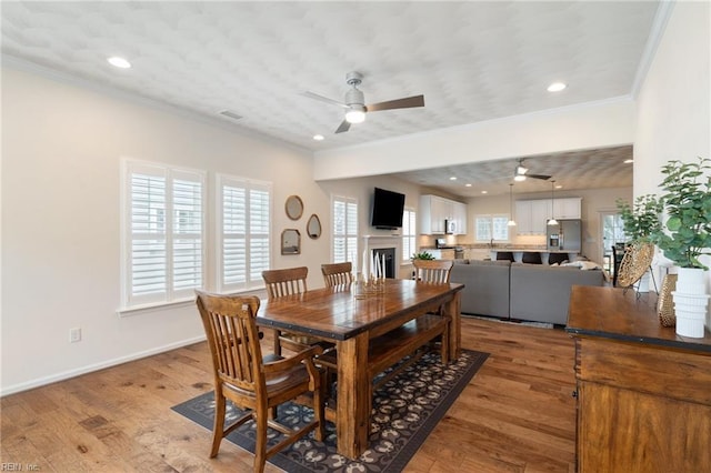 145 Beacon Run, Suffolk, VA 23435 - dining area with ceiling fan, ornamental molding, healthy amount of natural light, recessed lighting, and light wood-style flooring