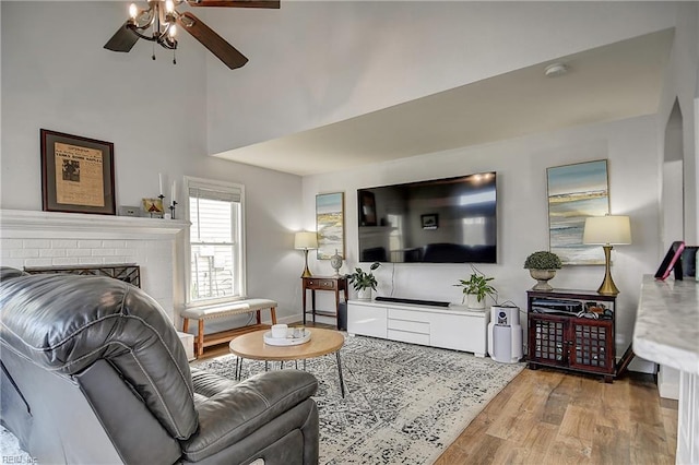 3145 Crestwood Ln, Virginia Beach, VA 23453 - living area with a ceiling fan, light wood-type flooring, a brick fireplace, and a towering ceiling