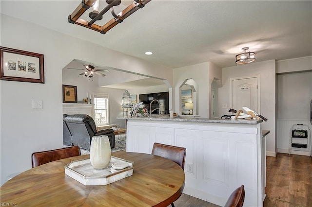 3145 Crestwood Ln, Virginia Beach, VA 23453 - dining area with a chandelier, a fireplace, dark wood finished floors, ceiling fan, and recessed lighting
