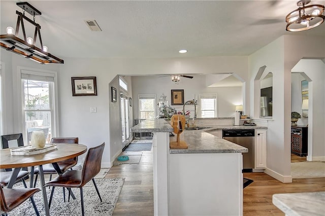 3145 Crestwood Ln, Virginia Beach, VA 23453 - kitchen with dishwasher, a sink, white cabinets, light wood-style floors, and recessed lighting