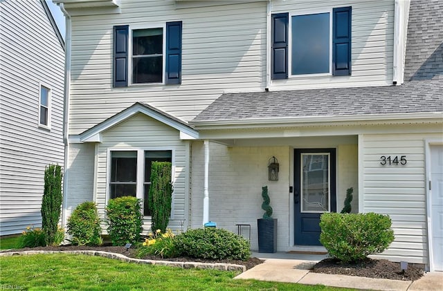 3145 Crestwood Ln, Virginia Beach, VA 23453 - view of exterior entry featuring brick siding and roof with shingles