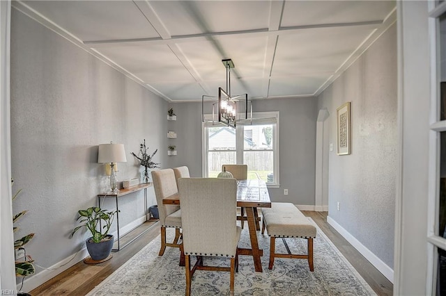 3145 Crestwood Ln, Virginia Beach, VA 23453 - dining room with wood finished floors, a chandelier, baseboards, a textured wall, and crown molding