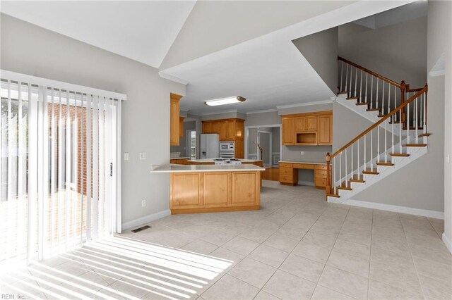 2288 Souverain Ln, Virginia Beach, VA 23454 - kitchen featuring white refrigerator with ice dispenser, baseboards, a peninsula, light tile patterned flooring, and light countertops