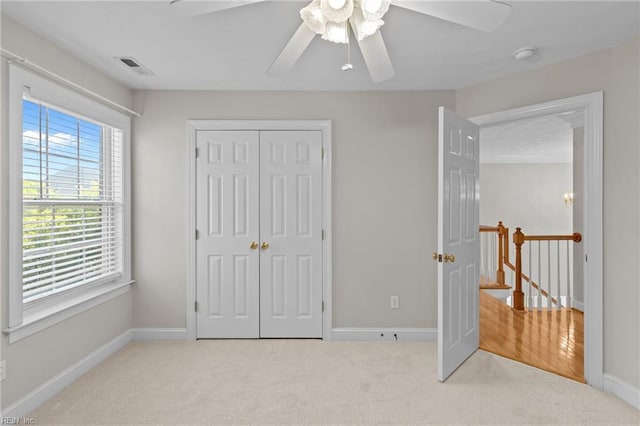 2288 Souverain Ln, Virginia Beach, VA 23454 - unfurnished bedroom featuring carpet, baseboards, a closet, and a ceiling fan
