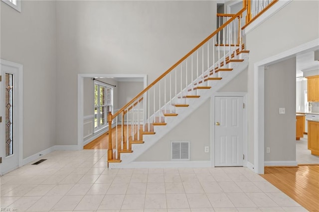 2288 Souverain Ln, Virginia Beach, VA 23454 - entryway with a towering ceiling, stairs, and baseboards