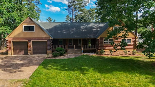235 Aspen Blvd, Yorktown, VA 23692 - cabin with log siding, a porch, concrete driveway, and a front lawn