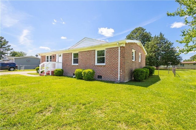 1204 Blythewood Ln, Suffolk, VA 23434 - view of property exterior featuring crawl space, a lawn, and brick siding
